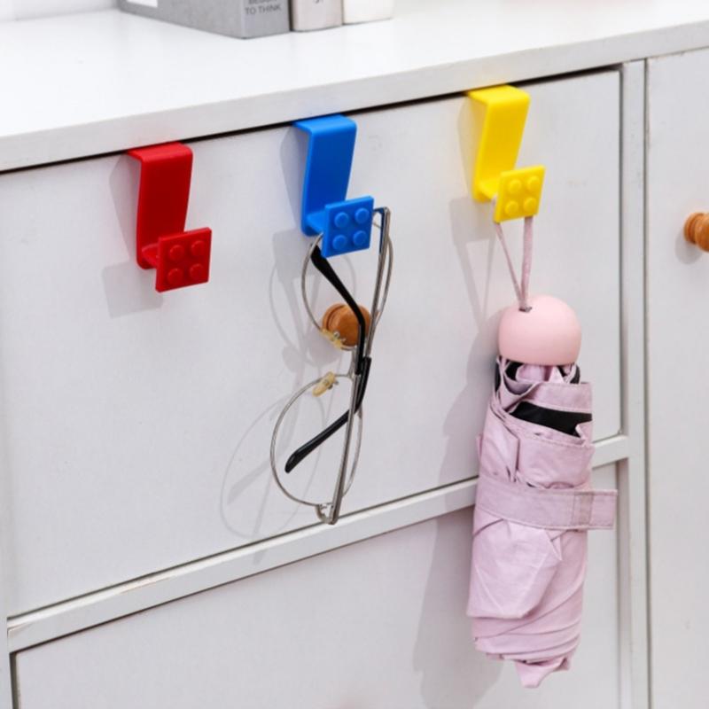 Baustein Cartoon Haken zum Aufhängen von Müllbeuteln Plastiktüten an Schranktüren Einfache Installation Heimküchenorganisation Mehrzweck-Nutzhänger