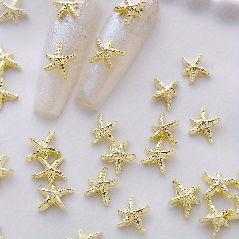 Goldene Seestern-Nagelanhänger Meeresstil Glitzernde Strasssteine Stern-Nagelkunst-Dekorationen Frühling Sommer 10 Stück 3D-Legierung DIY-Nagelsteine Geschenk für Mädchen