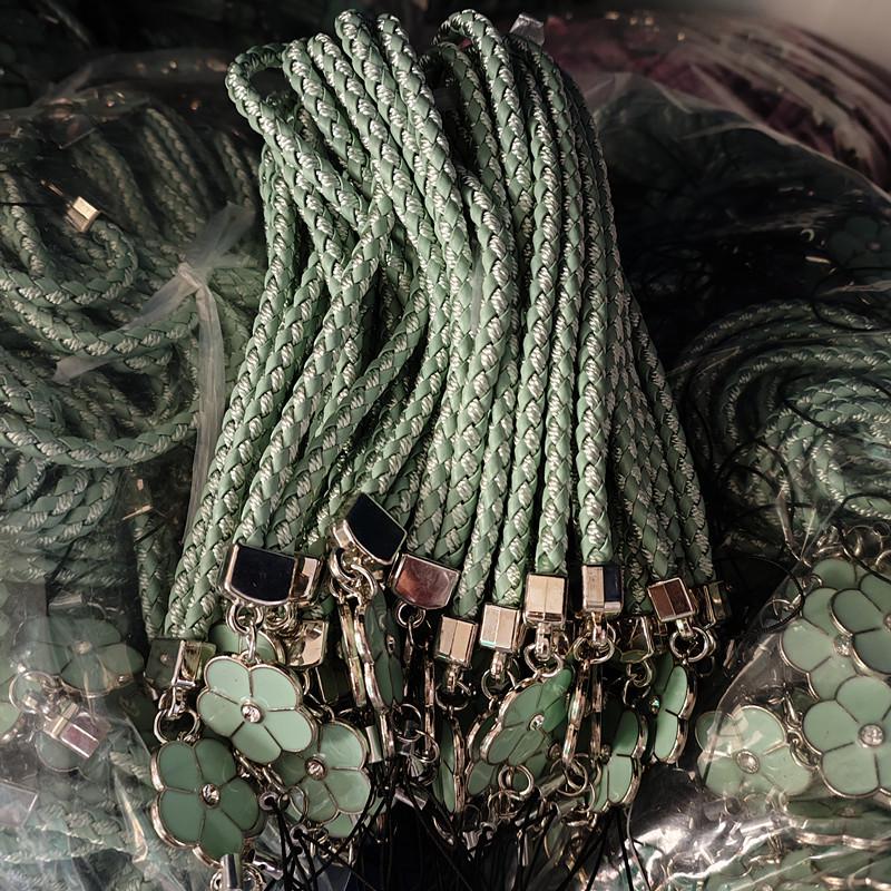 Camellia Four-Leaf Clover PU Leather Phone Wrist Lanyard with Nylon Woven Cord and Phone Case Pendant