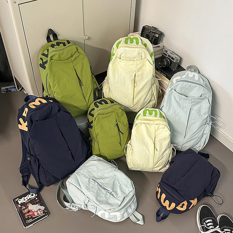 Solid color simple outdoor style backpack women's design sense niche light schoolbag high-value large-capacity backpack women