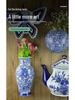 Hand-Painted Blue and White Ceramic Wall Vase with Floral and Bird Design