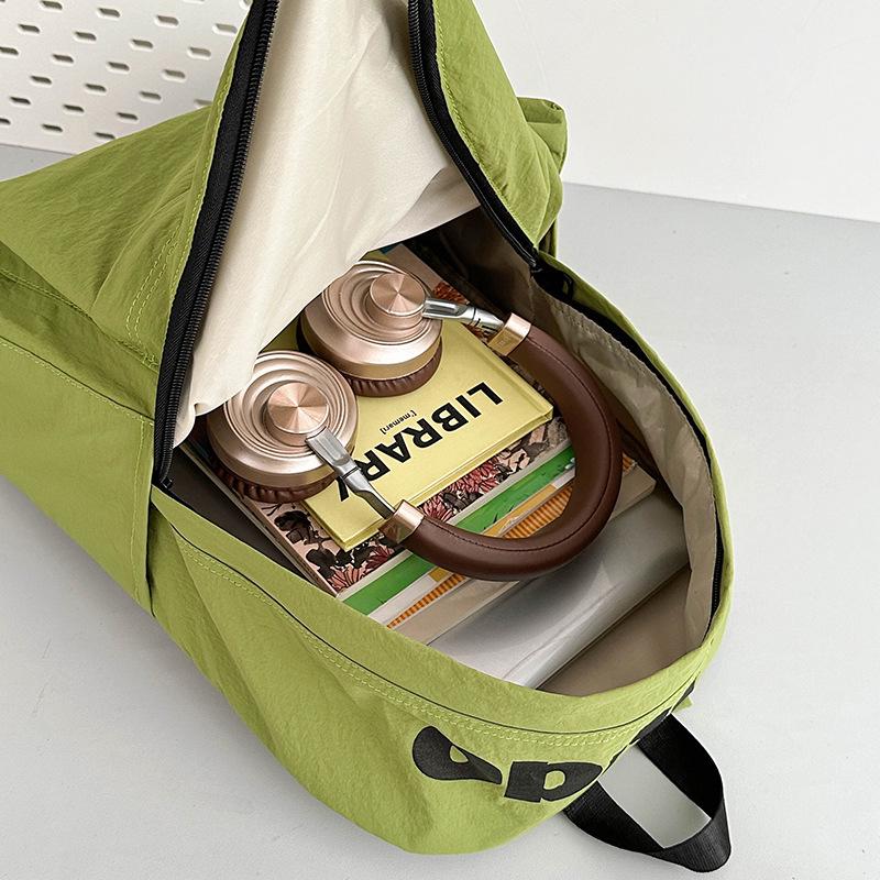 Lightweight Minimalist Backpack for Female Students: Versatile Double-Shoulder Bag for School and Travel.