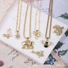 Gold-Plated Copper Necklace with Zircon Elephant, Butterfly, and Bee Pendants