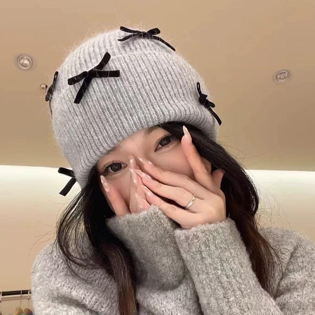 Korean ins autumn and winter warm sweet wool hat women contrasting color bow knitted ear protector face small pile hat tide