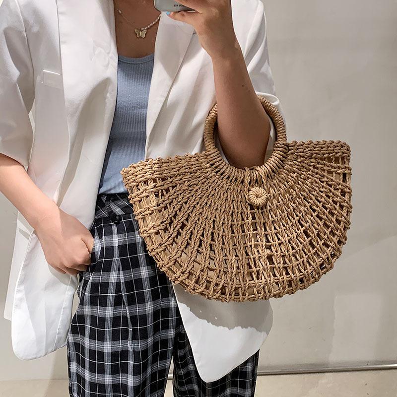 2025 New Straw Woven Bag Bag Round Bucket Hollow Papyrus Woven Bag Korean Version Casual Portable Women's Bag Hand-held Crochet Bag