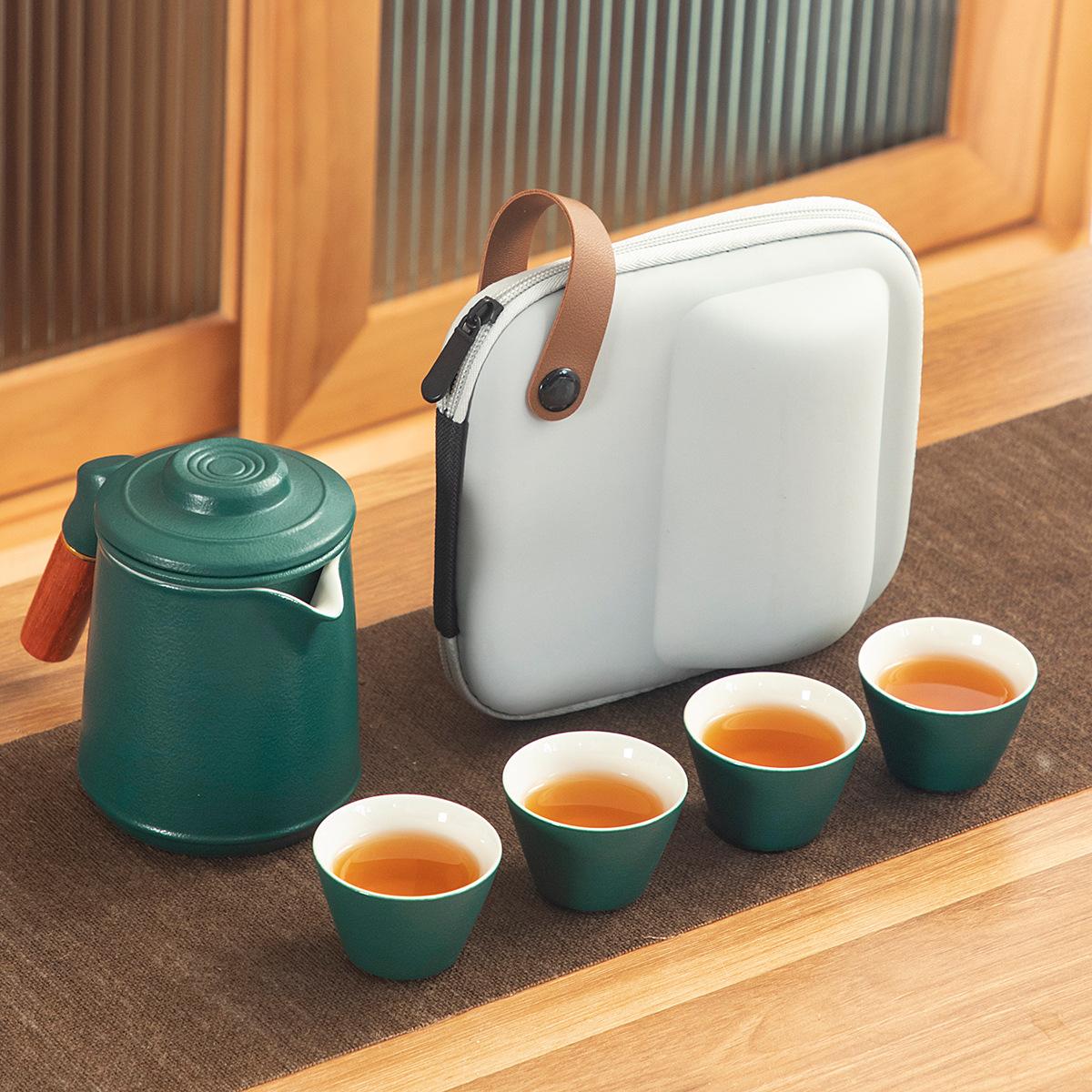 

Black pottery glaze retro ceramic Kuaike cup, one pot, three or four cups, portable bag, outdoor travel, kung fu tea set, gifts.