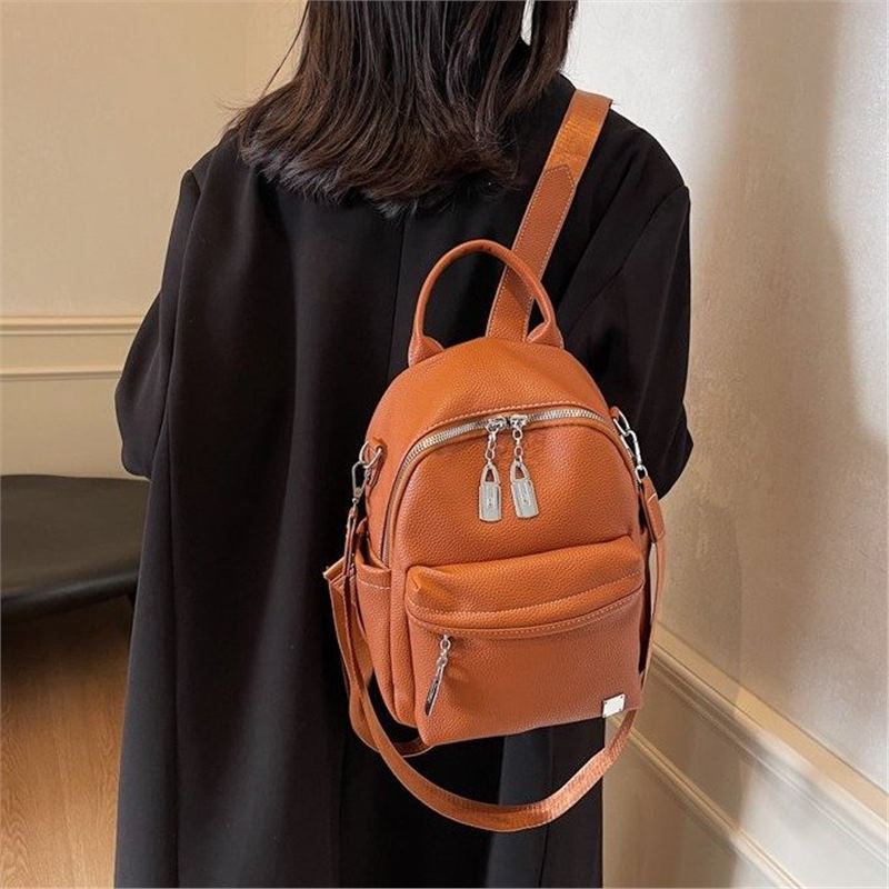 Schoolbag large capacity 1011 new casual versatile backpack portable single shoulder three-purpose schoolbag going out backpack
