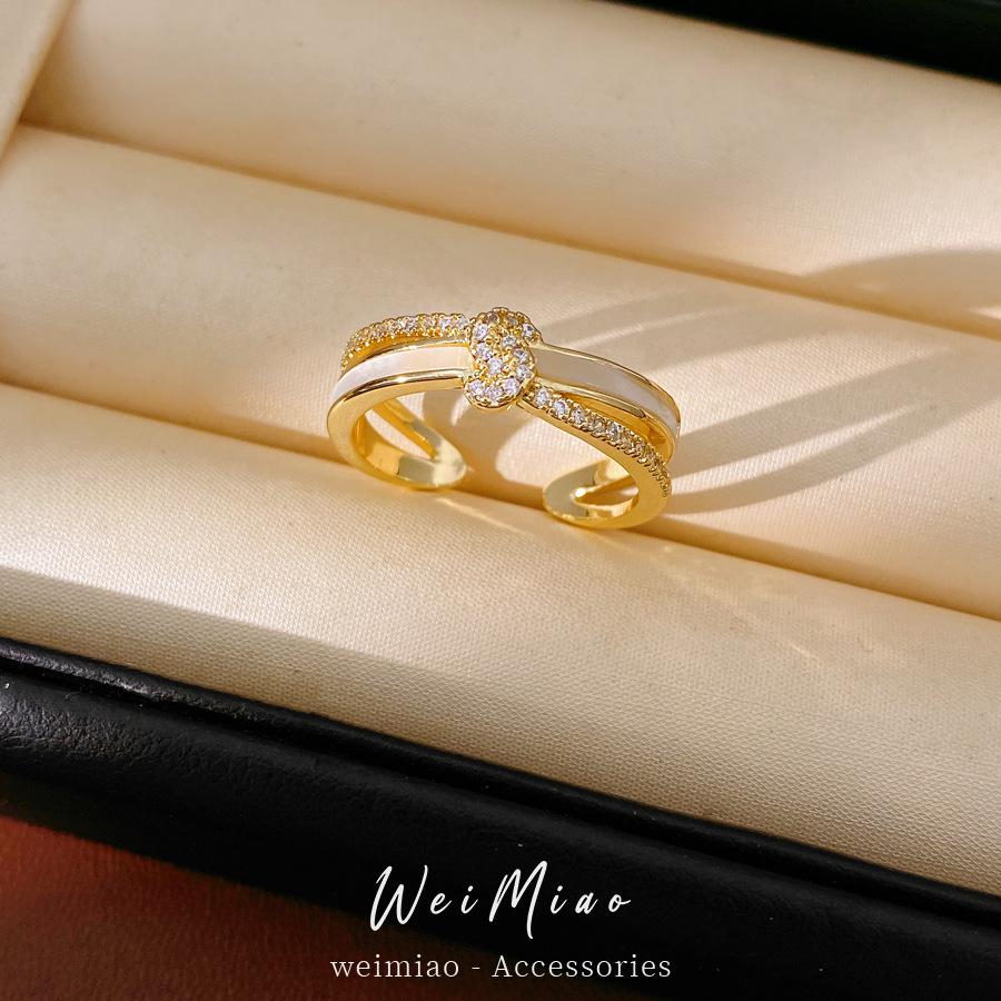 A Niche Sophisticated Knotted Double-layered Open-style Ring