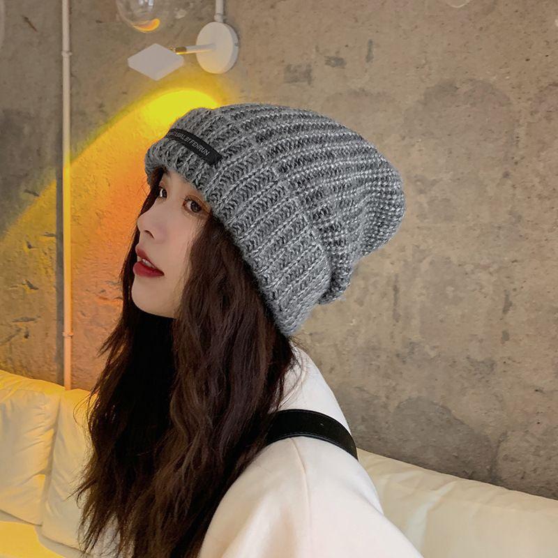 Women's Oversized Wool Beanie: Warm, Stylish, Knitted Hat with Ear Protection for Autumn & Winter.