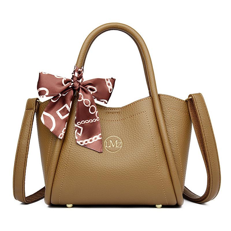 

Soft leather European and American women s crossbody handbag 2025 new atmospheric send mother fashion middle-aged women s bag large capacity коричневый