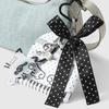 Trendy Musical Note Keyring Key Holder Featuring Piano Keys And Delicate Bowknot Perfect For Music Enthusiasts