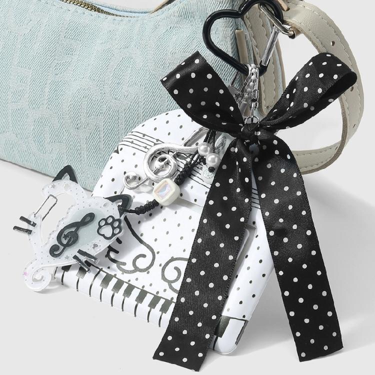 Trendy Musical Note Keyring Key Holder Featuring Piano Keys And Delicate Bowknot Perfect For Music Enthusiasts