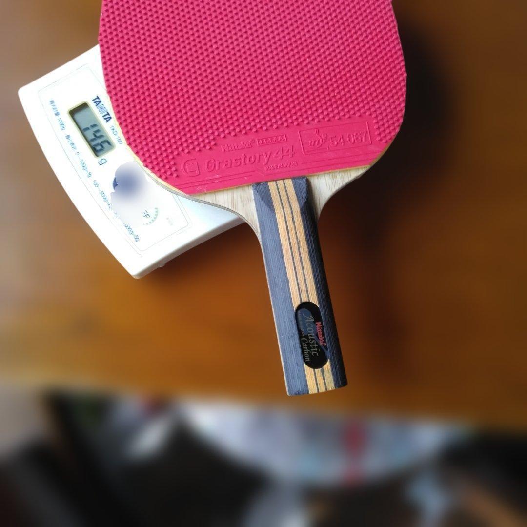 Used Nittaku Acoustic Carbon with rubber for large racket