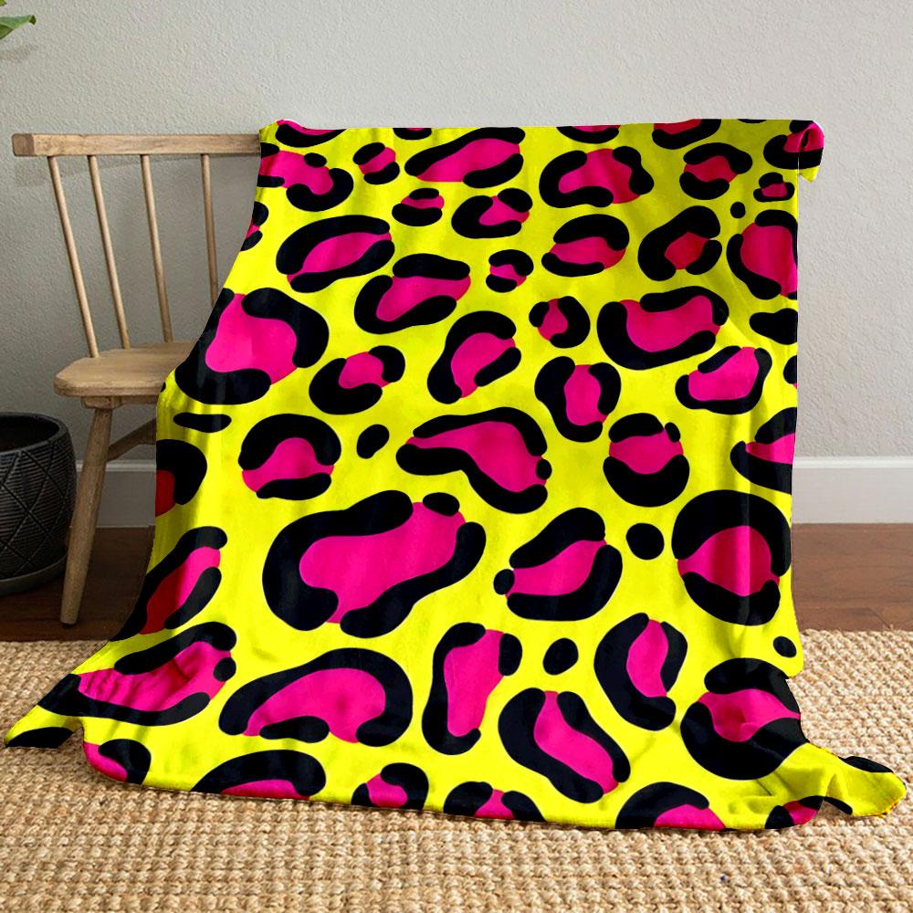 Bright pink leopard spots outlined in black on a yellow background. for all seasons blanket lunch break throw gift