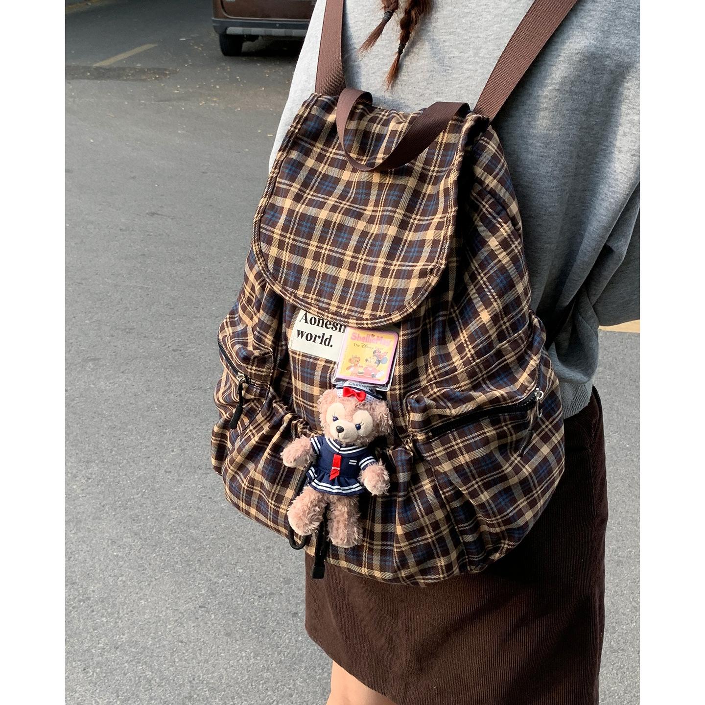 

Korean version of casual large-capacity canvas bag women s 2025 new plaid backpack fashion student bag travel backpack