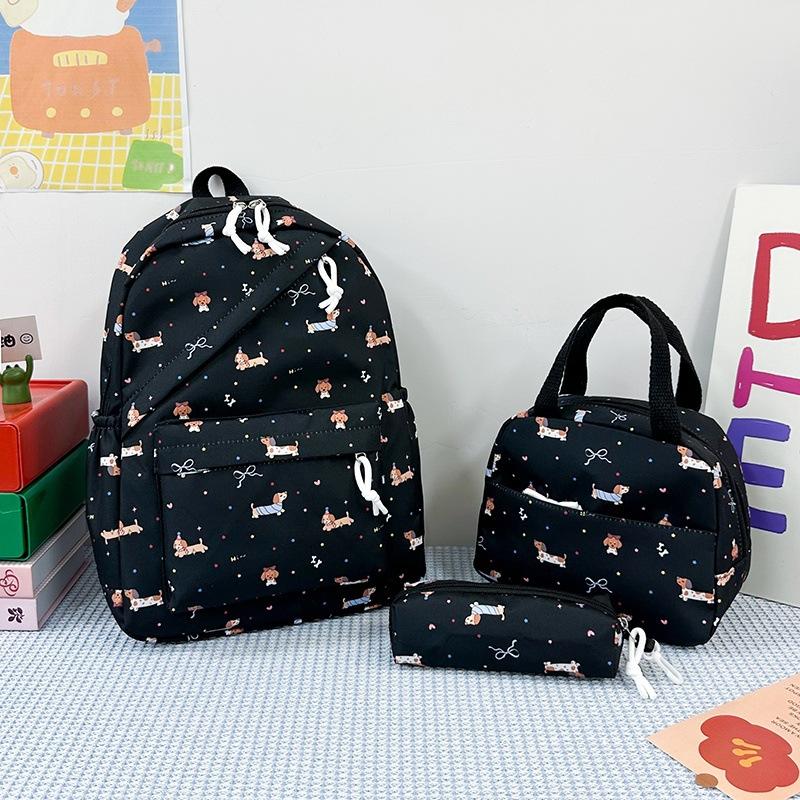 New cartoon printed women's schoolbag, junior high school and primary school students reduce the burden of three-piece backpack, large-capacity