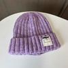Women's autumn and winter wool jacquard letter labeling wool hat casual thermal bald hat women's loose knitted stacking hat