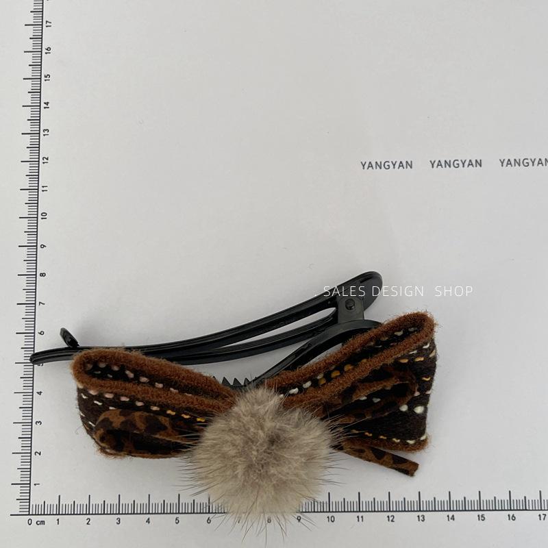 Autumn/Winter Pompon Bow Twist Hair Clip: Versatile Fashion Accessory for Updo Styles