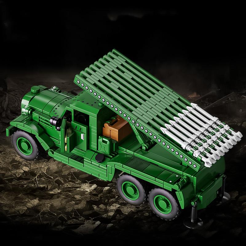 Boys assemble toys Soviet Katyusha multiple rocket launcher building blocks heavy transport vehicles self-propelled artillery