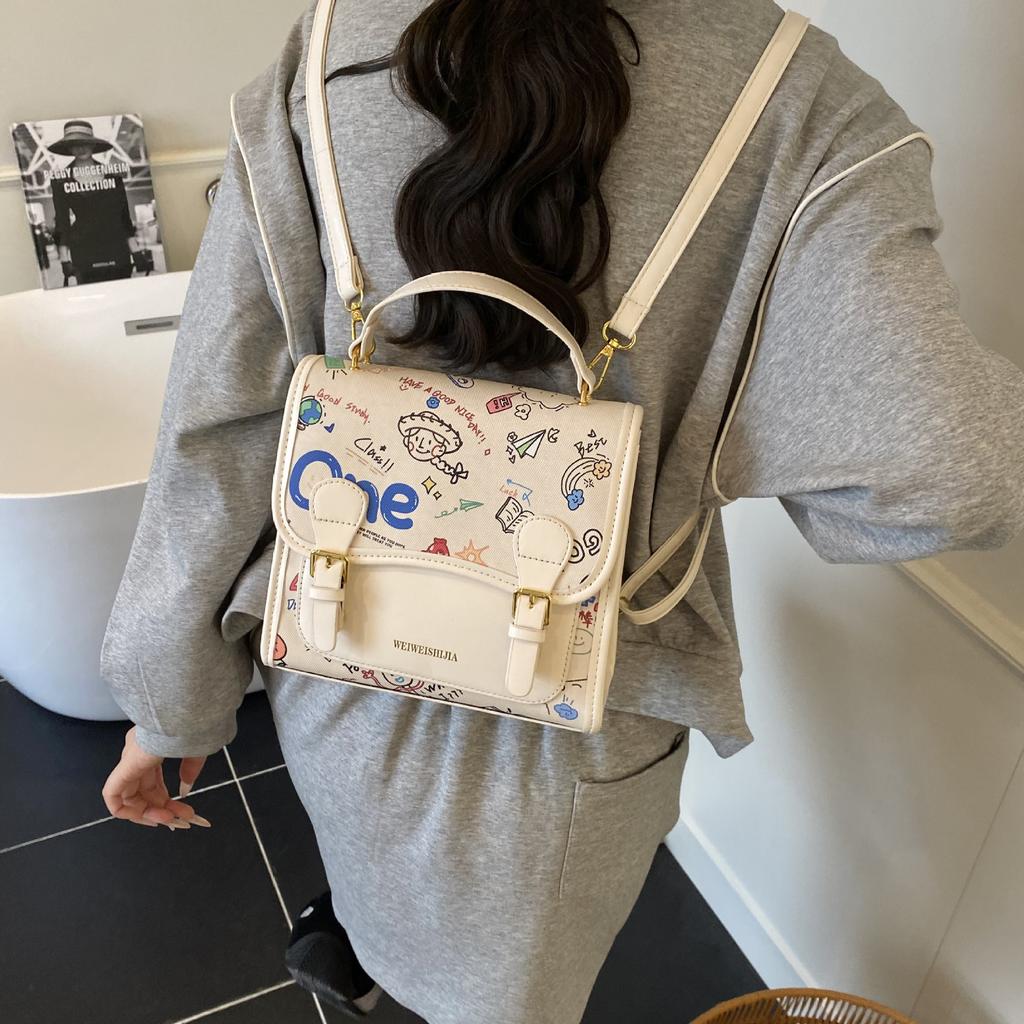 Korean version of college style cute cartoon printed handbag women 2025 new fashion casual backpack student schoolbag