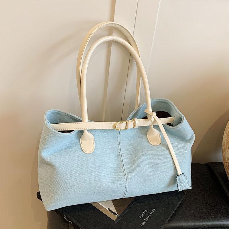 2025 neue modische europäische und amerikanische lässige Stil kontrastierende Farben Achsel Tragetasche Damen große Kapazität vielseitige High-End Schultertasche