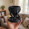 Black spiral tree-shaped designer flowerpot for plants