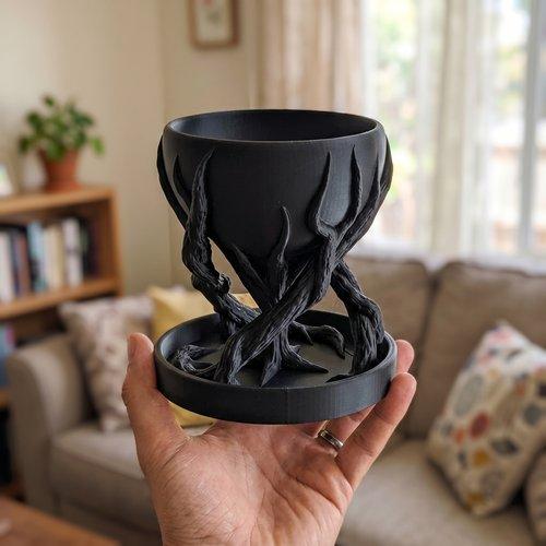 Black spiral tree-shaped designer flowerpot for plants
