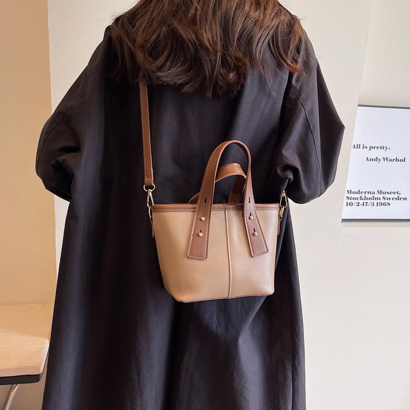 Niche design bucket bag women's bag new contrasting color handbag texture foreign style shoulder bag feeling messenger bag