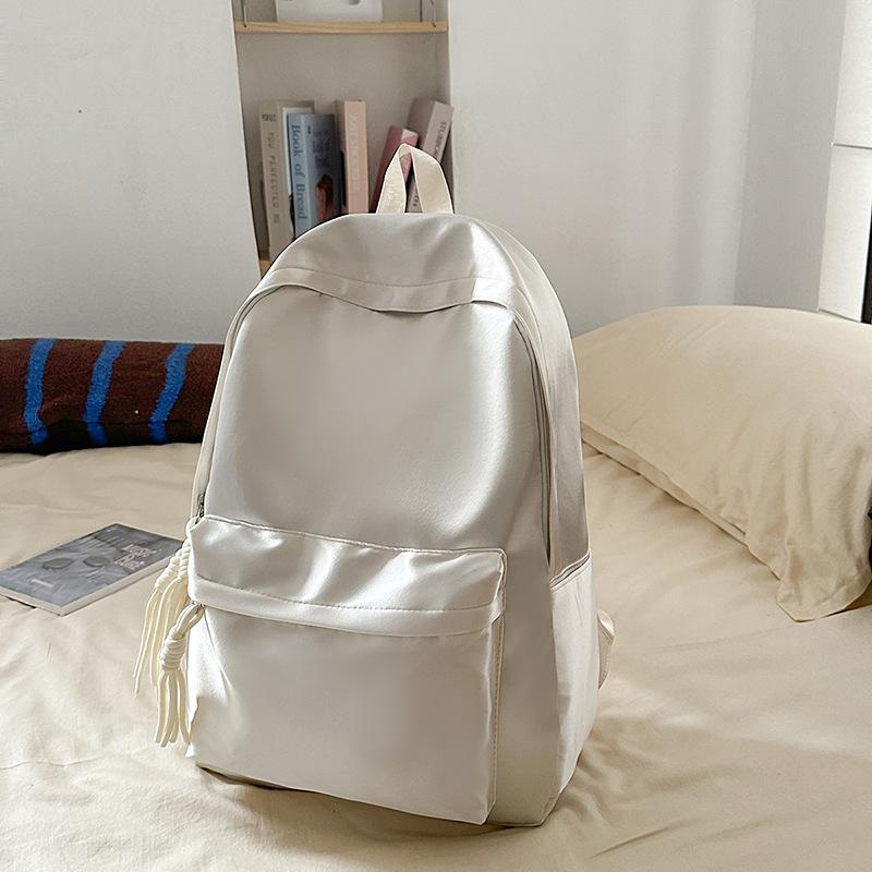 School bag solid color light and simple Korean version of college students Japanese versatile large-capacity small backpack girl light backpack