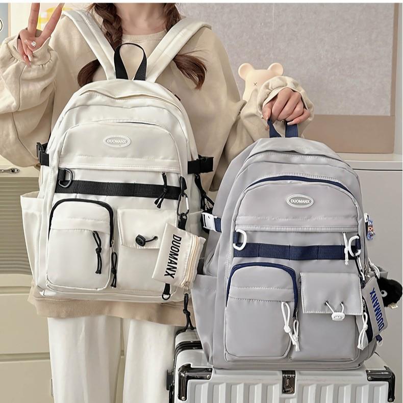 Simple solid color casual backpack high value junior high school student schoolbag large capacity versatile tooling backpack