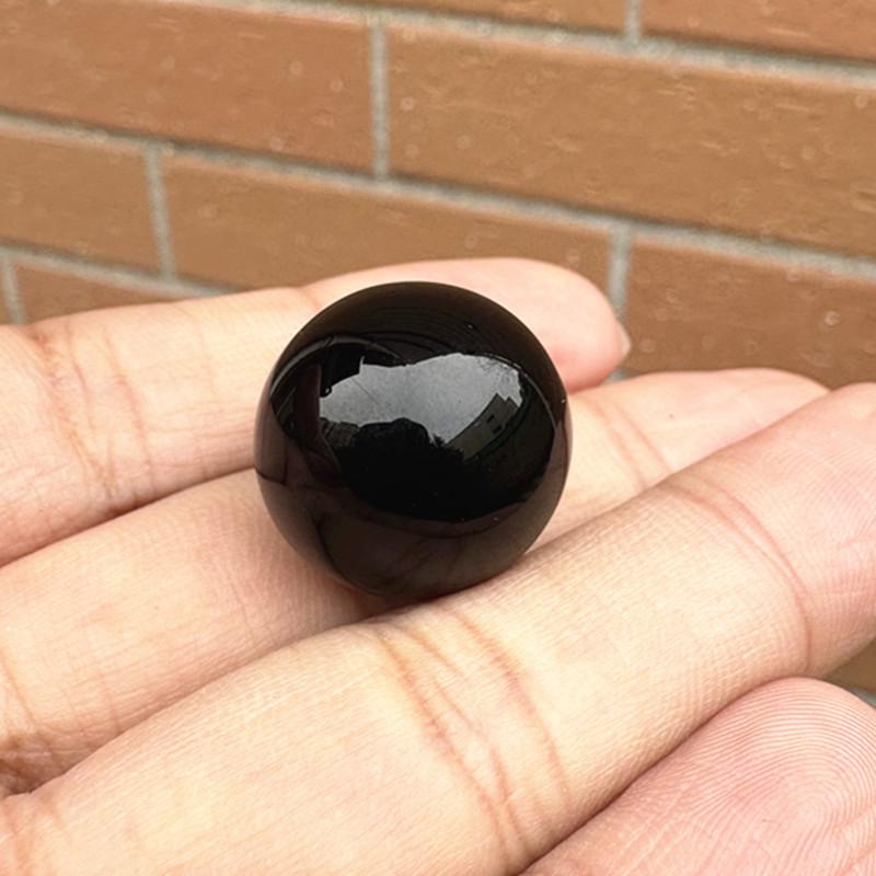 Black Stone Round Glass Ball Sculpture with Inlaid Eyes - No-Hole Design for Display and Decoration