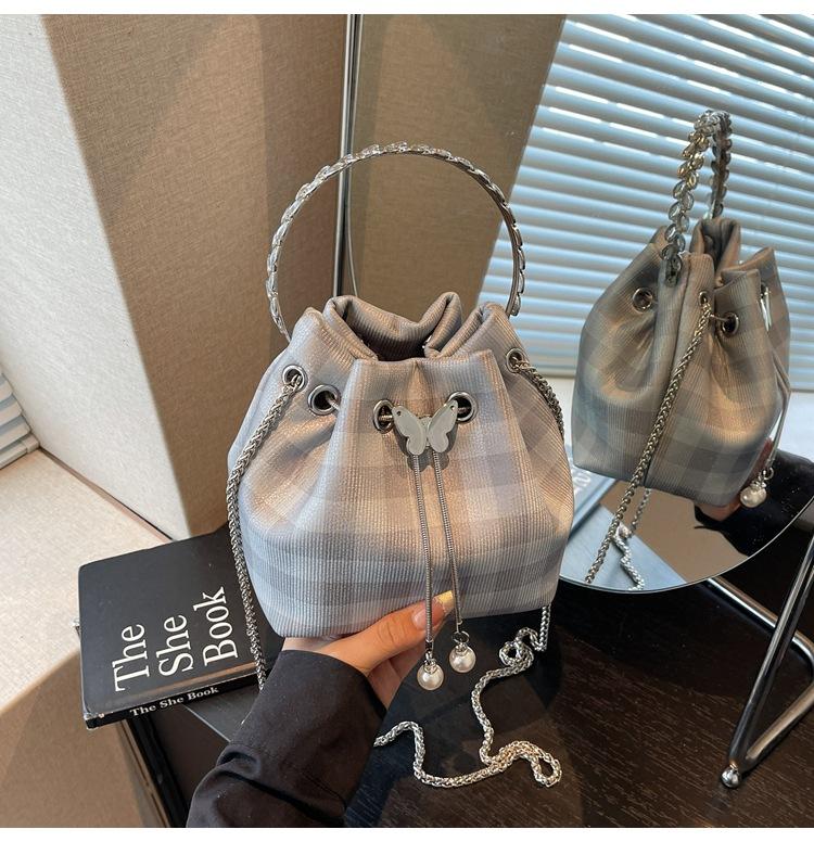 Karomuster Tasche Damen Sommer neue Mode Nische Kette Umhängetasche Kordelzug plissierte Bucket Bag