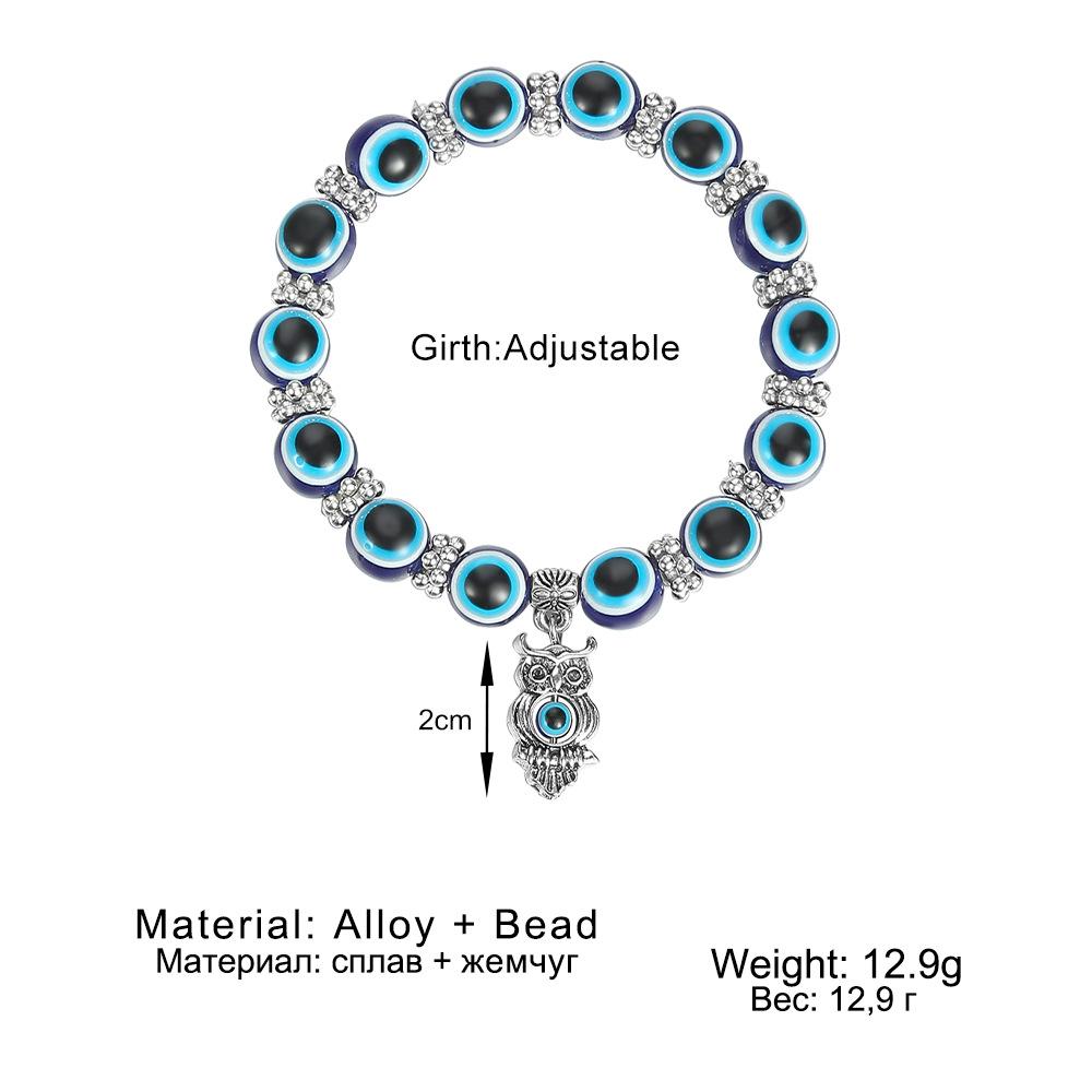 Beliebtes blaues Nazar-Armband mit Schmetterling-, Elefanten-, Fatimas Hand-Anhängern & Harzperlen