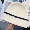 Korean-style Simple Color-block Striped Beanie, a Warm Knitted Hat for Women, Perfect for Autumn and Winter, and Designed To Make the Face Appear