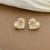 Elegant Heart-Shaped Freshwater Pearl Stud Earrings - Stylish, Luxurious, and Versatile for Women.