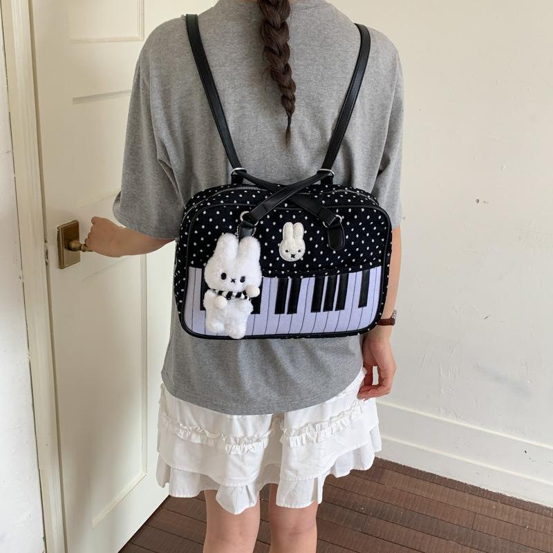 School bag: Korean polka dot piano retro filter, sweet girl niche shoulder bag, gentle playful, girly dual-use backpack