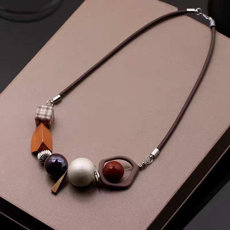 

New decorative items clothing necklaces accessories women s personality short sweaters chain locks bone chains color blocked bead necklaces 50 cm коричневий
