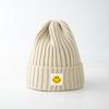 Smiley face label wool hat female autumn and winter warm bag head couple trendy brand cold hat solid color student male knitted hat