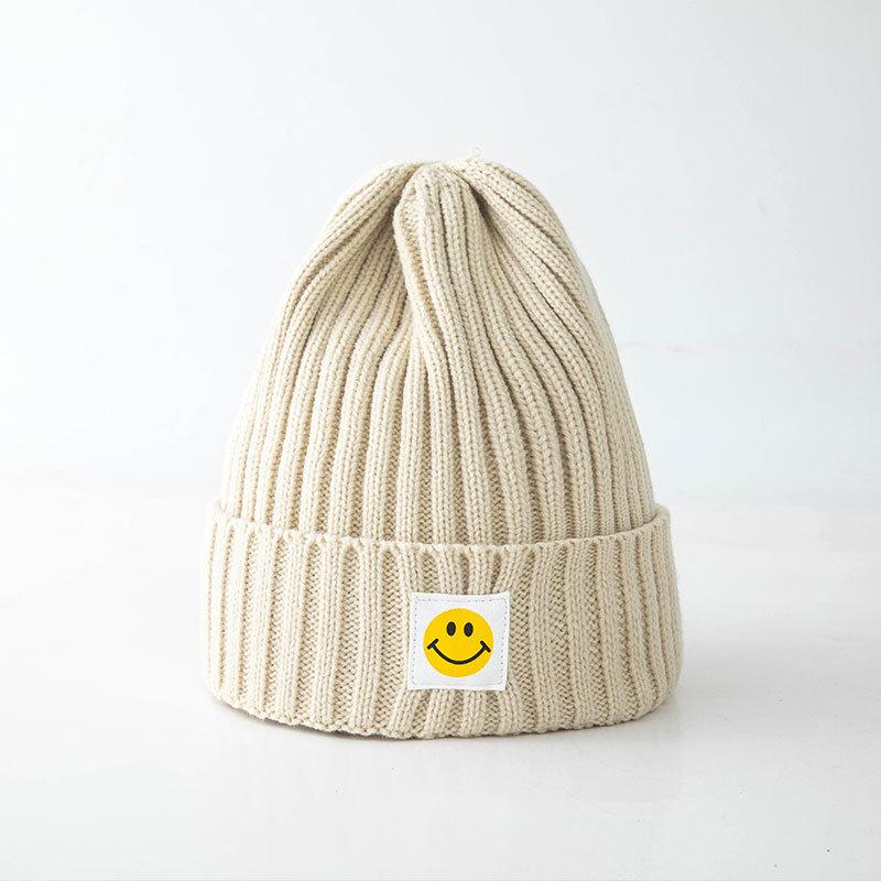 Smiley face label wool hat female autumn and winter warm bag head couple trendy brand cold hat solid color student male knitted hat
