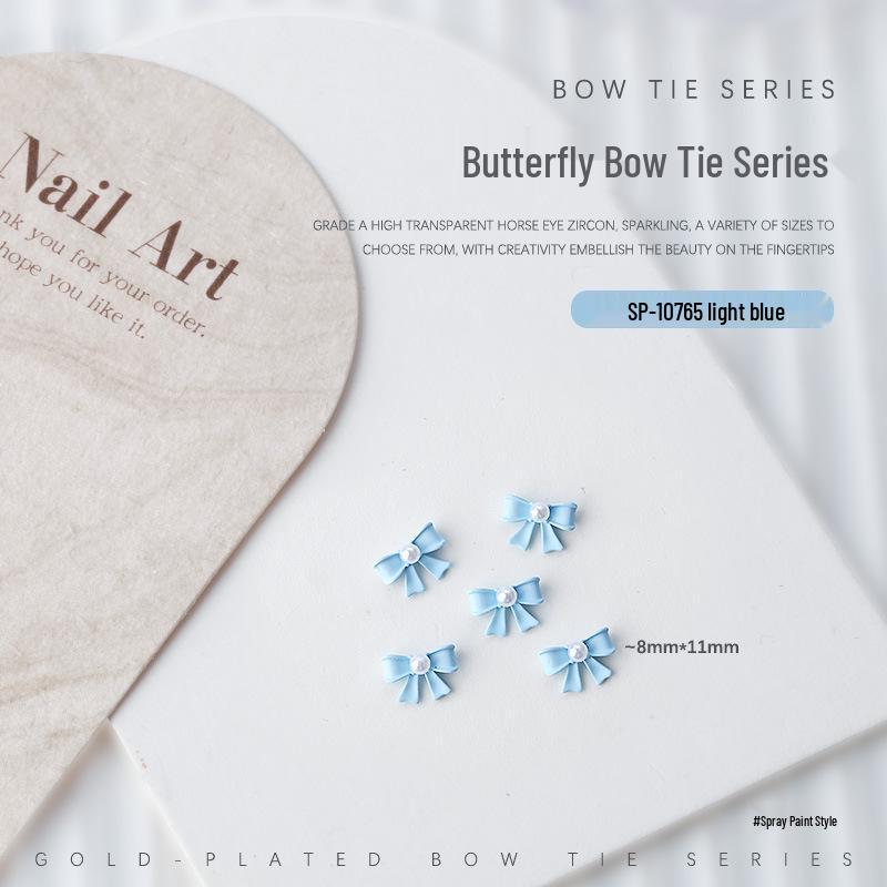 

Nail Art Accessories: Pearl and Metal 3D Bow & Butterfly Rhinestones (5 Pieces)