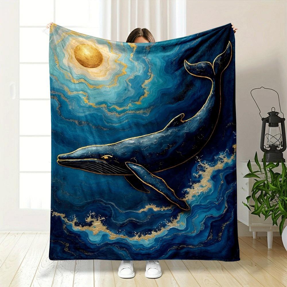 A golden-accented whale swimming in swirling blue waves under a gold sun. for all seasons blanket lunch break throw gift