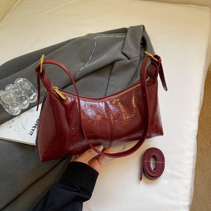 

Сумка высокой ценности женская сумка 2025 новая осенняя портативная сумка-мессенджер нишевый зарубежный стиль подмышечная сумка на плечо сумка-багет бордовый