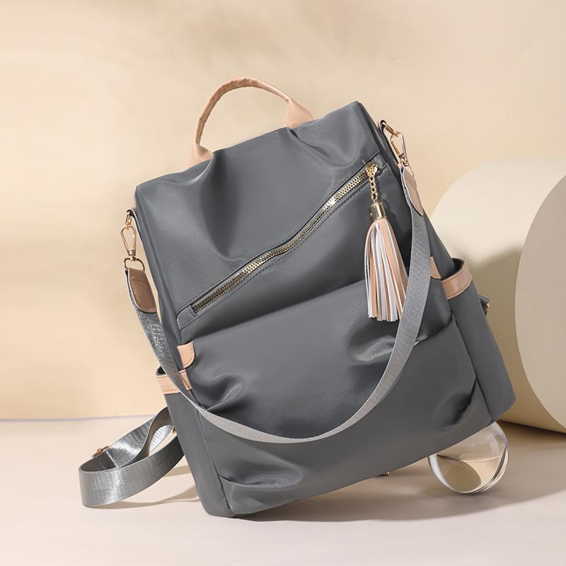 

Новый повседневный женский рюкзак из нейлона с защитой от краж, модный рюкзак для путешествий с кисточкой, многофункциональный серый
