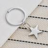 Porte-clés en acier inoxydable étoile à cinq branches Design 3D lisse Pendentif de sac tendance Porte-clés pratique ne se décolore pas