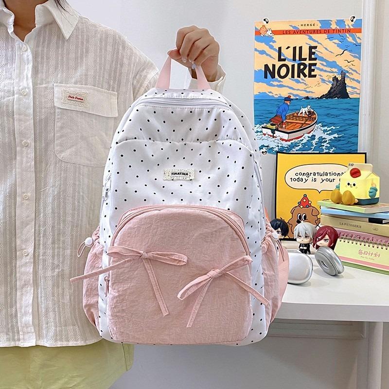 The new schoolbag is high-value, fresh and sweet, candy-colored polka dot bow backpack, junior high school backpack.