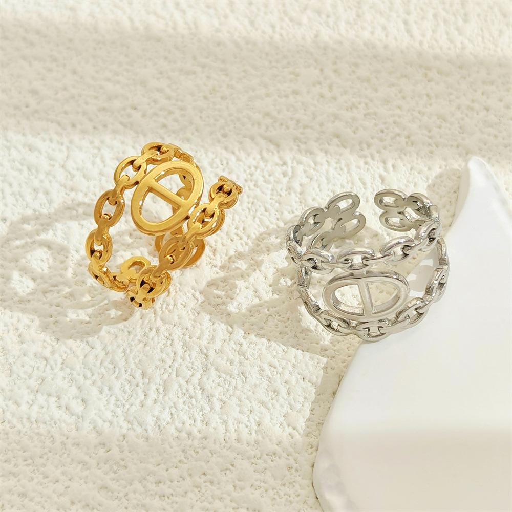 Stainless Steel Hollow Ring - European & American Cold Style Niche Design Light Luxury Women's Fashion