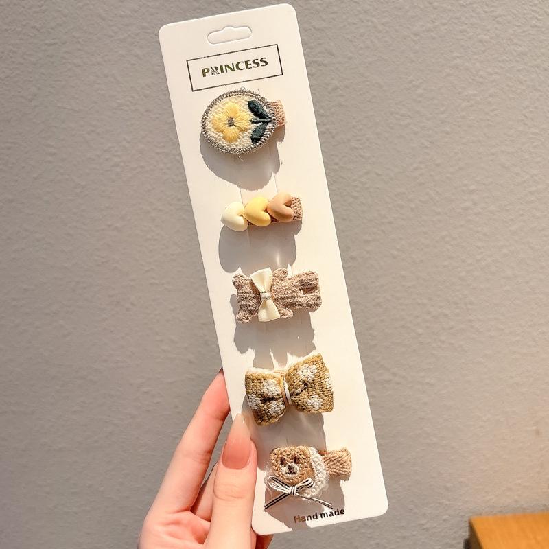 Bedårande babyvänliga luddiga hårklämmor för barn
