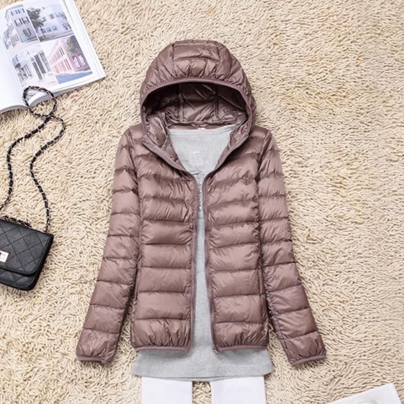 Giacca trapuntata bianca leggera con cappuccio da donna per l'inverno, per uso quotidiano