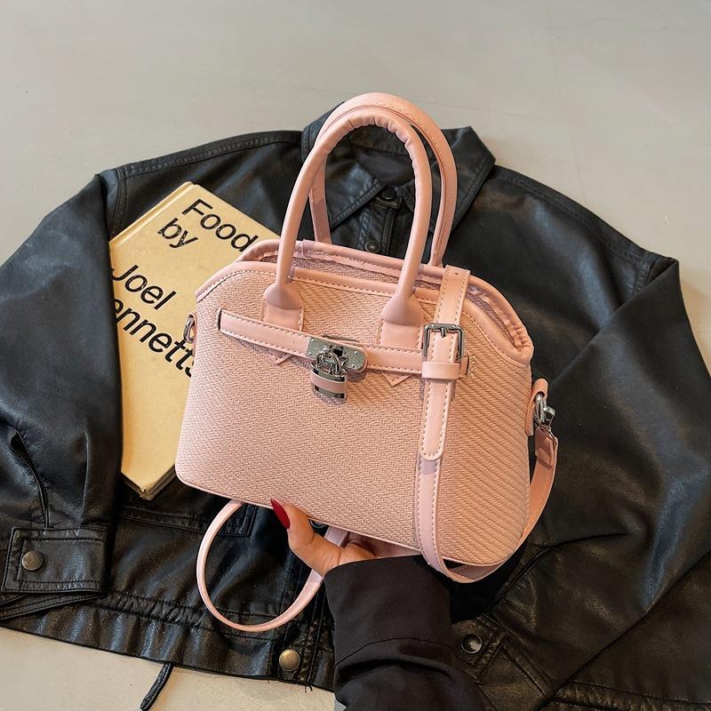 

Niche versatile casual hand bucket bag women 2025 new retro simple striped shoulder messenger bag