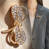 Elegant Rhinestone Bow Brooch Pin - Luxury Alloy Design for Women's Clothing